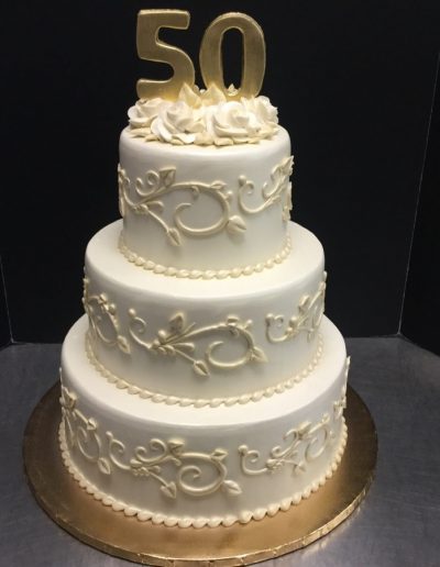 Christine's Cakes & Pastries - 3 Tier-Buttercream Wedding Cake with hand piped scroll work (Fondant Topper with buttercream roses)