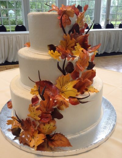 Christine's Cakes & Pastries - 3 Tier-Buttercream wedding cake with fondant detail leaves