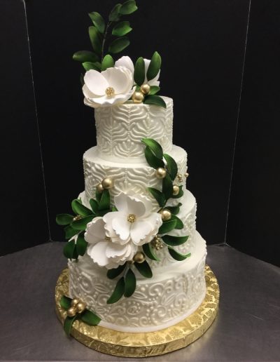 Christine's Cakes & Pastries - 4 Tier-Buttercream Wedding Cake with art deco design (Gum paste flower Accent)