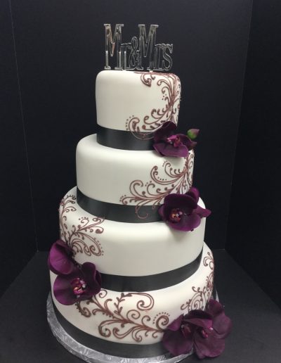Christine's Cakes & Pastries - 4 Tier-Fondant Wedding Cake ribbon and detail scroll work (Gum paste flower Accent)